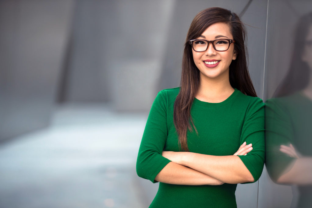 woman with green shirt standing